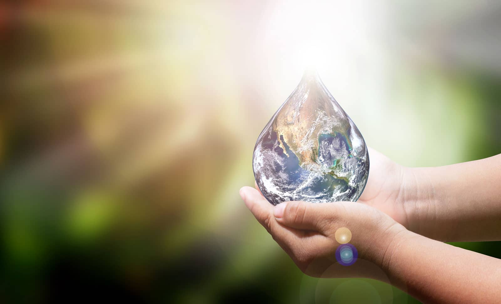 computer generated water droplet held in two hands